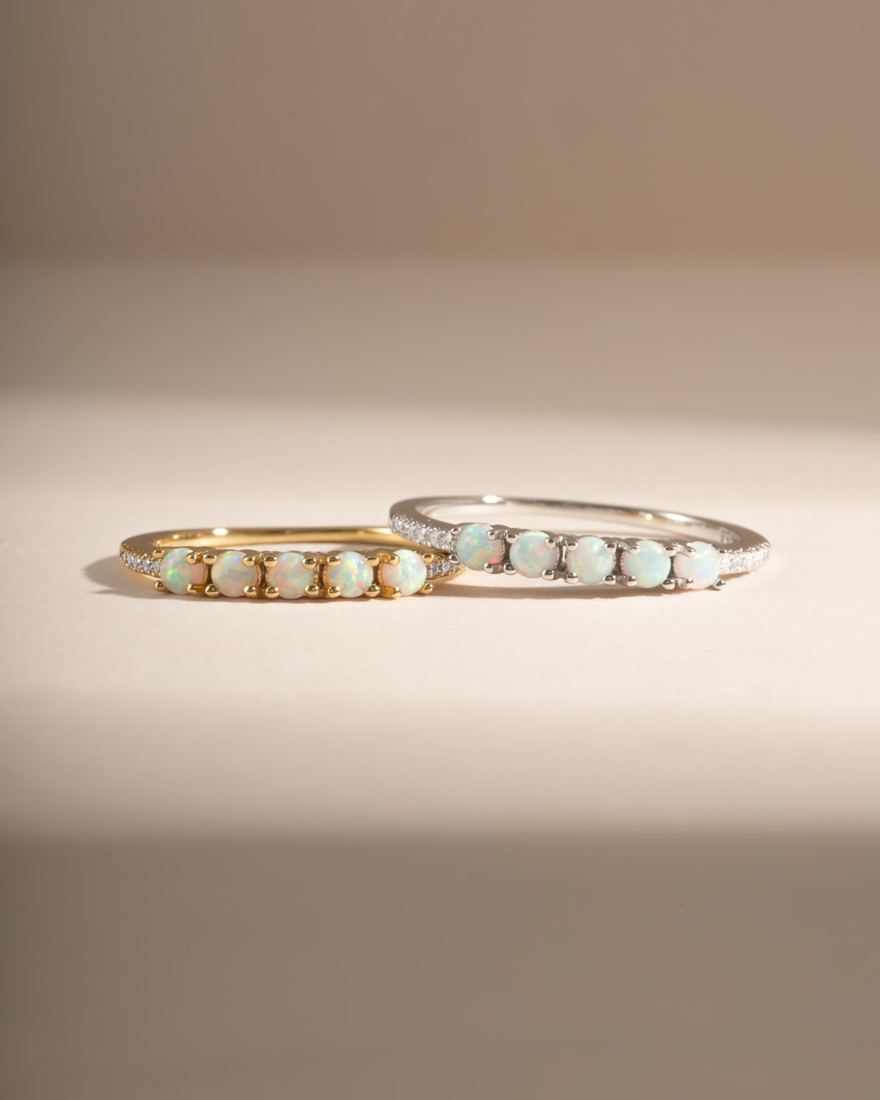 Sami Jewels five-stone opal ring featuring gold and sterling silver band with vibrant, colorful opal stones.