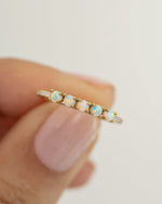 Close-up of Sami Jewels 5 Stone Opal Ring showcasing five vibrant opal stones set in gold.
