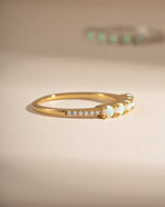 Gold 5-stone opal ring from Sami Jewels, side view showcasing vibrant opal stones and elegant band design.