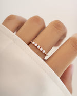 Sami Jewels five-stone opal ring with rose gold band, featuring vibrant, multi-colored opal gemstones in a elegant jewelry design.