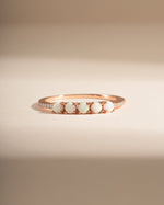 Sami Jewels 5-stone opal ring with rose gold band featuring five vibrant opal gemstones arranged in a elegant design.