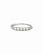 Sterling silver 5-stone opal ring from Sami Jewels with vibrant, colorful opals set in a sleek band on a white background.