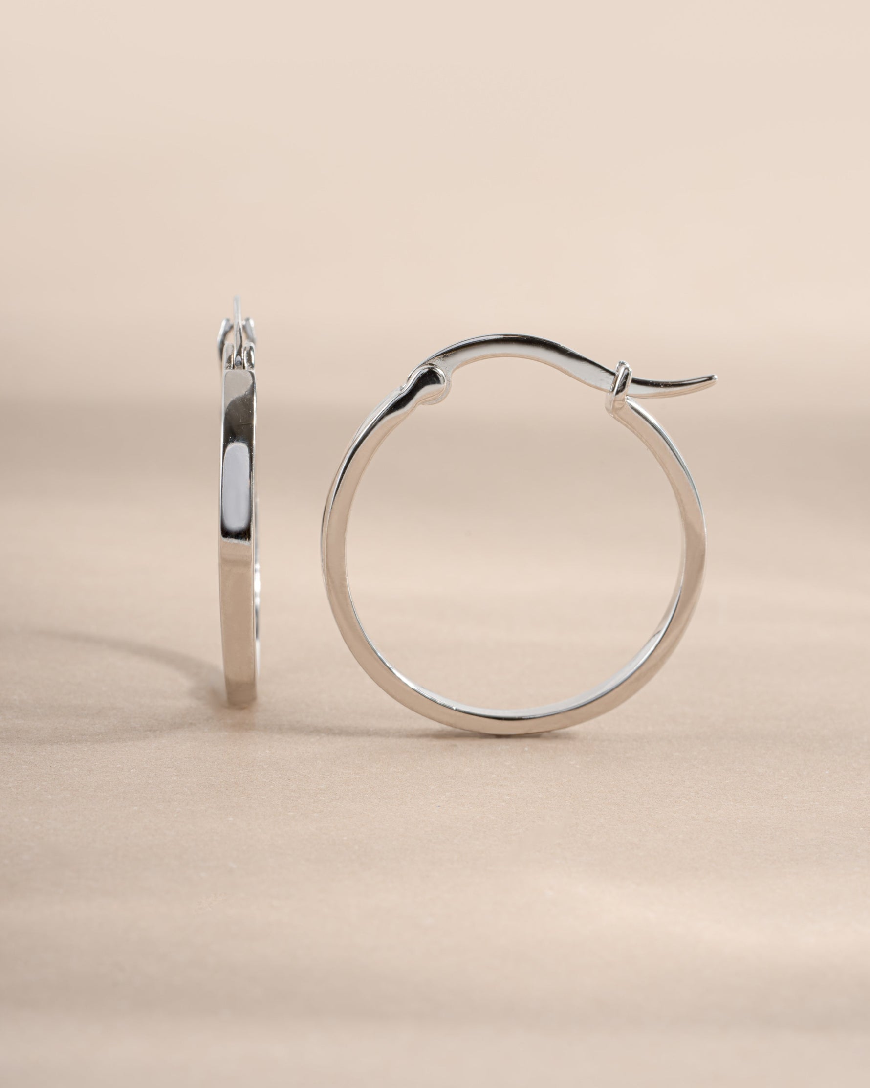 Sterling silver 18mm flat hoop earrings from Sami Jewels, side view showing sleek, minimalist design.