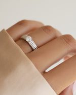 Sterling silver fluted solitaire CZ ring by Sami Jewels featuring a central sparkling cubic zirconia gemstone.