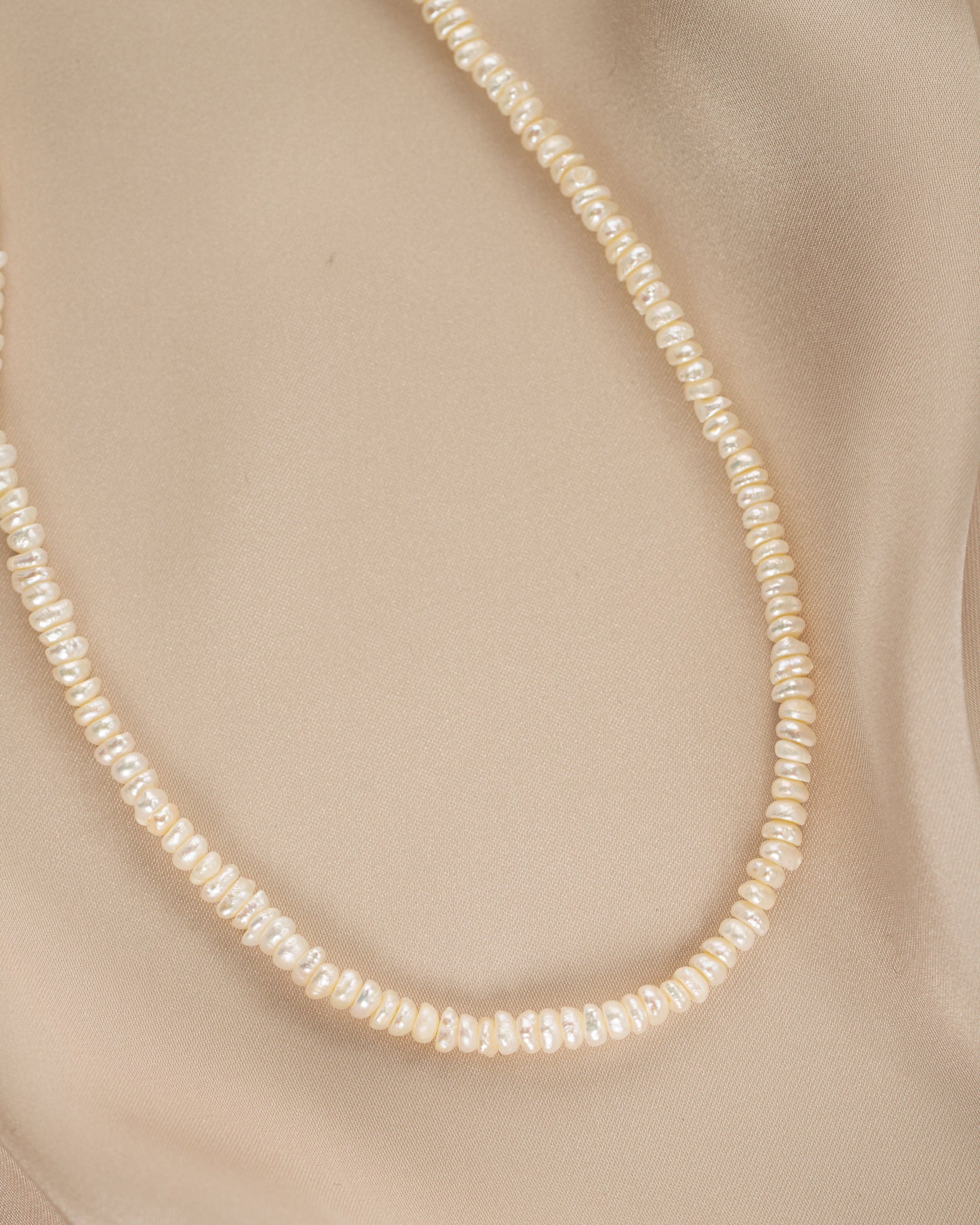 Close-up of a freshwater beaded pearl necklace by Sami Jewels, showcasing delicate pearls and intricate beading details.