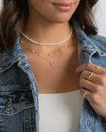 Freshwater beaded pearl necklace by Sami Jewels displayed on a model, showcasing elegant jewelry with lustrous pearls.
