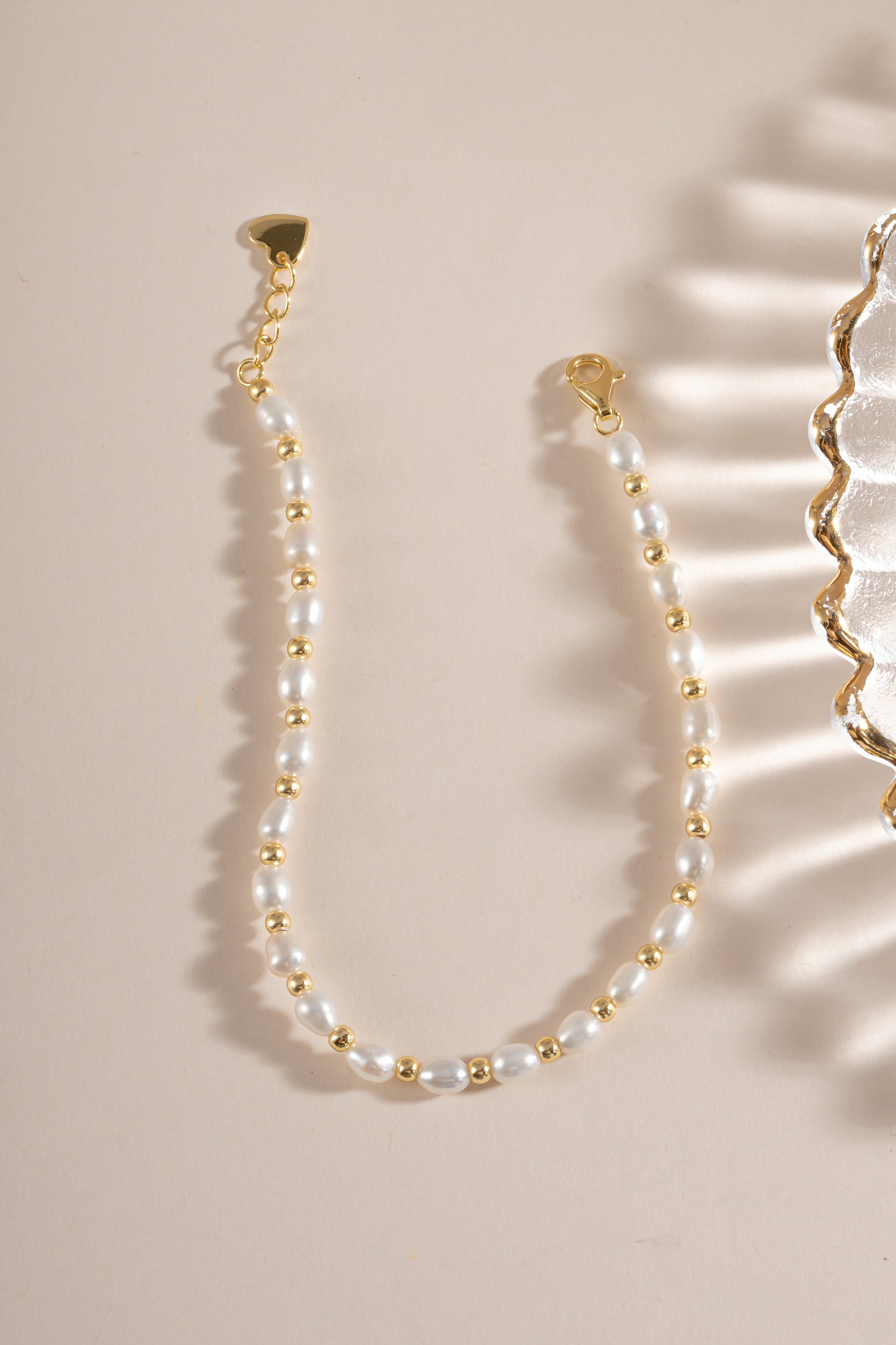 Freshwater pearl beaded bracelet by Sami Jewels featuring a gold lobster clasp closure.