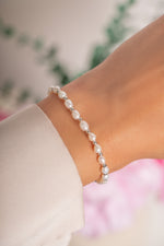 Freshwater pearl beaded bracelet by Sami Jewels featuring silver accents and delicate pearl beads on a flexible bracelet.