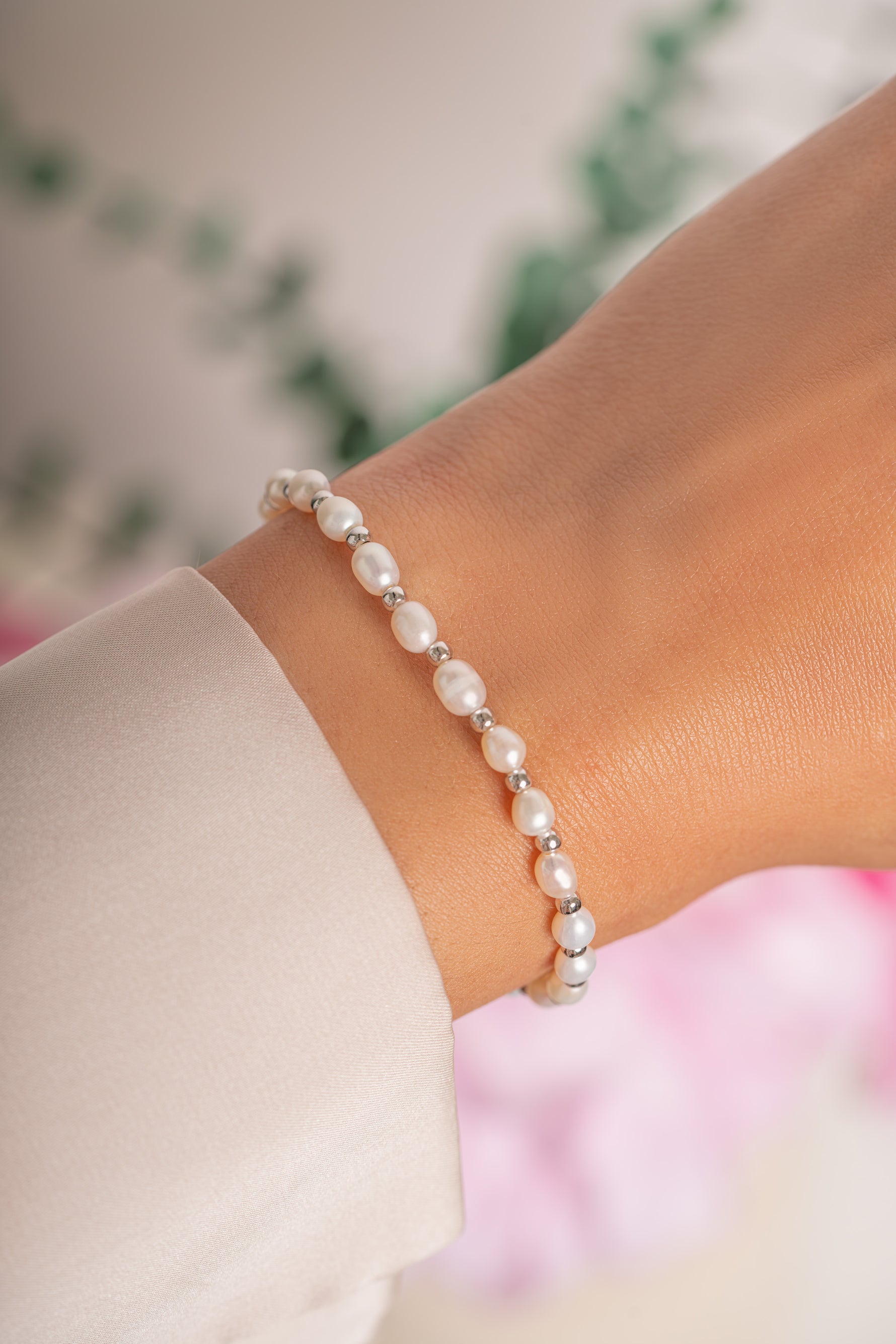 Freshwater pearl beaded bracelet by Sami Jewels featuring silver accents and delicate pearl beads on a flexible bracelet.