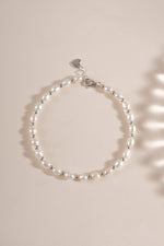 Close-up of a freshwater pearl beaded bracelet by Sami Jewels featuring sterling silver clasp and elegant pearl beads.