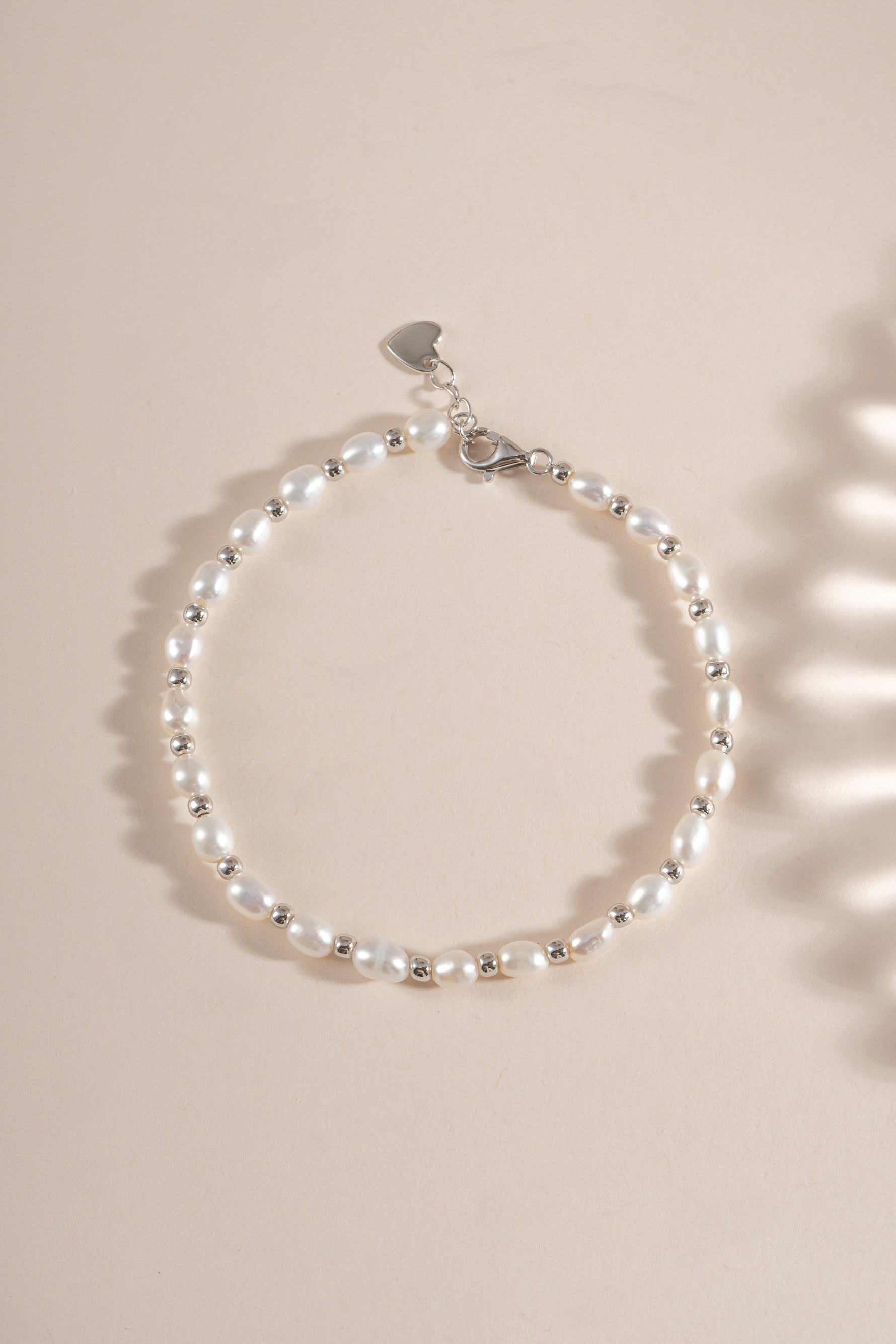 Close-up of a freshwater pearl beaded bracelet by Sami Jewels featuring sterling silver clasp and elegant pearl beads.