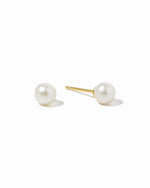 Gold freshwater pearl stud earrings by Sami Jewels, featuring smooth round pearls on a clean white background