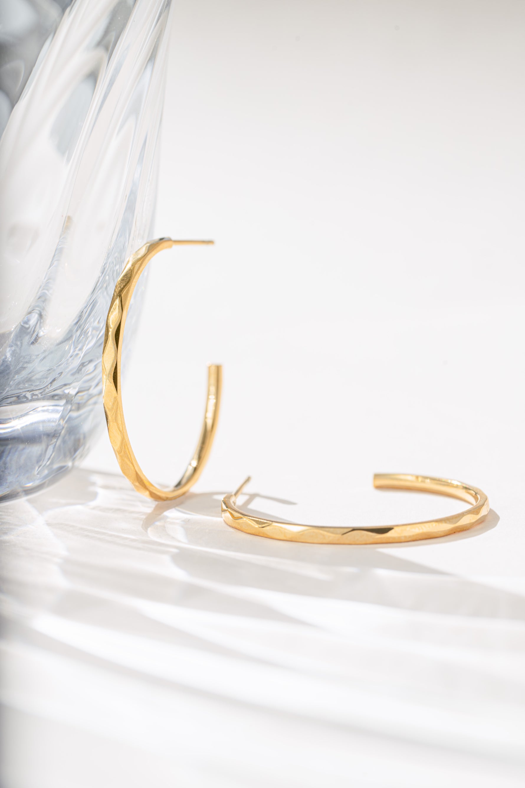 Close-up of gold stainless steel SS Geometric Hoops earrings by Sami Jewels, showcasing their modern geometric design.