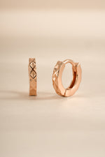 Rose gold Sami Jewels geometric pattern huggie earrings with modern, stylish design and intricate geometric details.