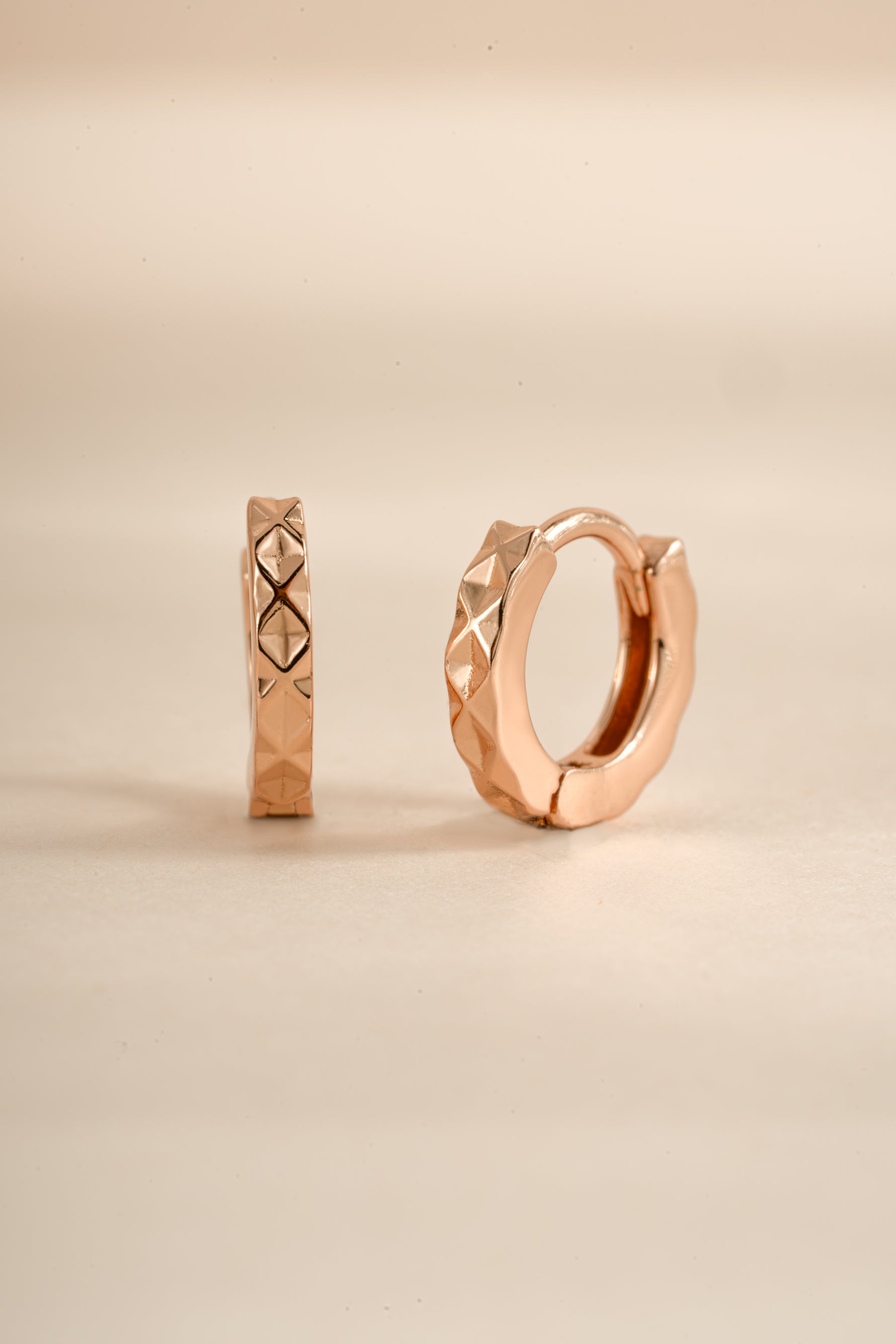Rose gold Sami Jewels geometric pattern huggie earrings with modern, stylish design and intricate geometric details.