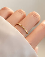 geometric stacking ring in gold worn on models hand