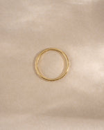 geometric stacking ring in gold on neutral background 