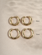10mm gold hoops and 12mm gold hoops on a simple background