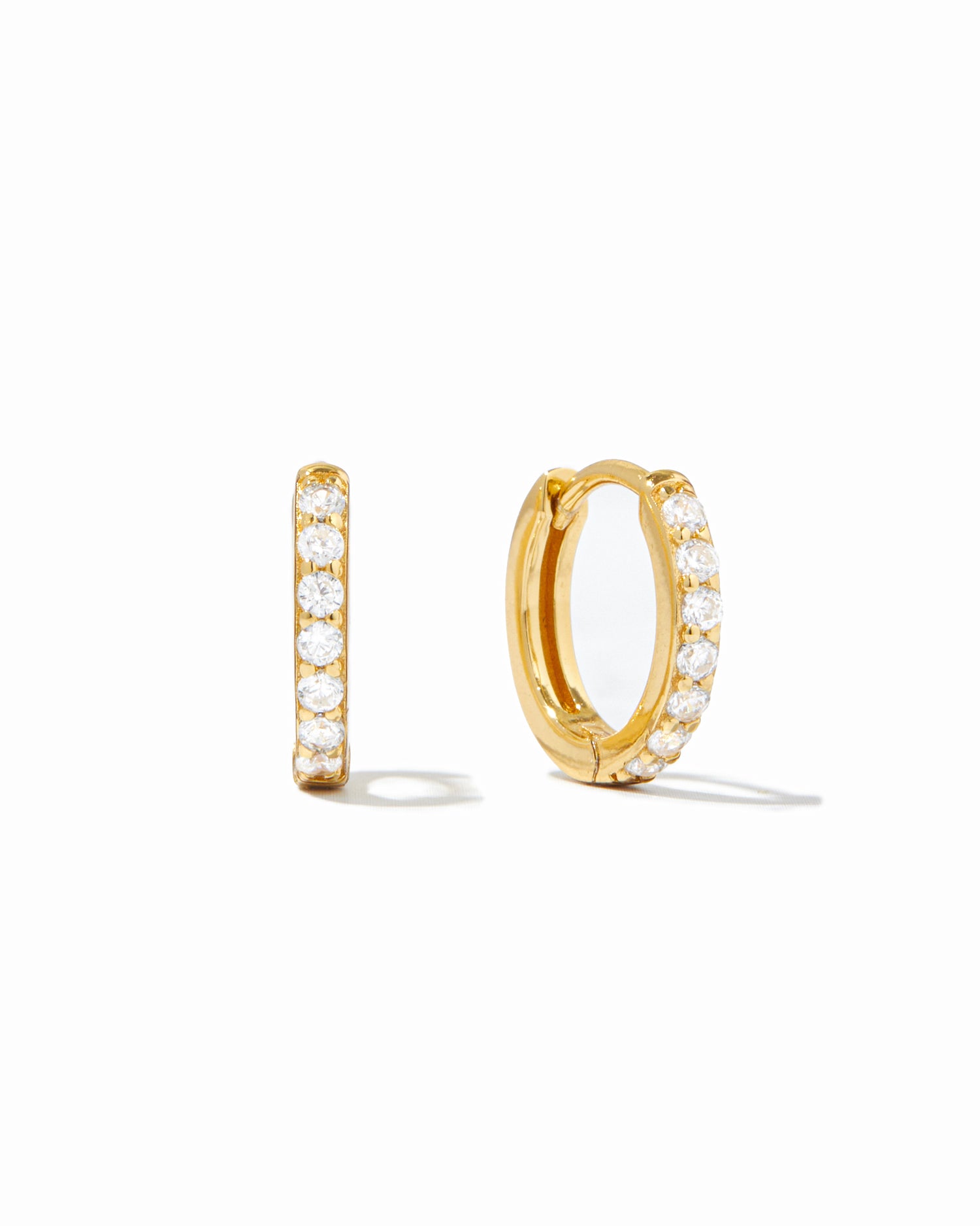 gold 10mm diamond huggie hoop earring white background