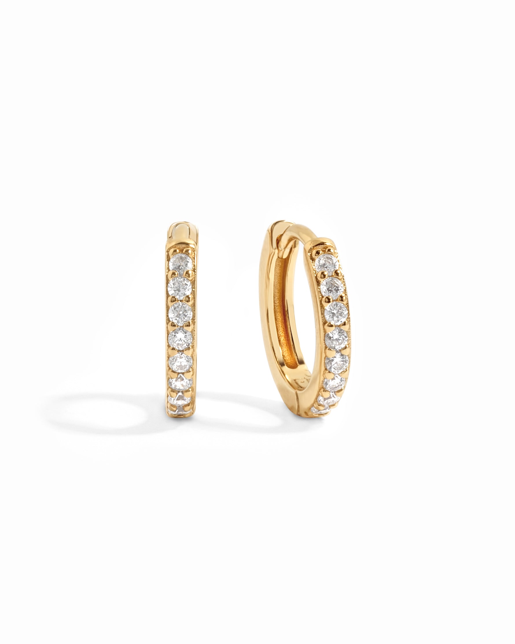 gold 11mm studded huggie hoop earring white background