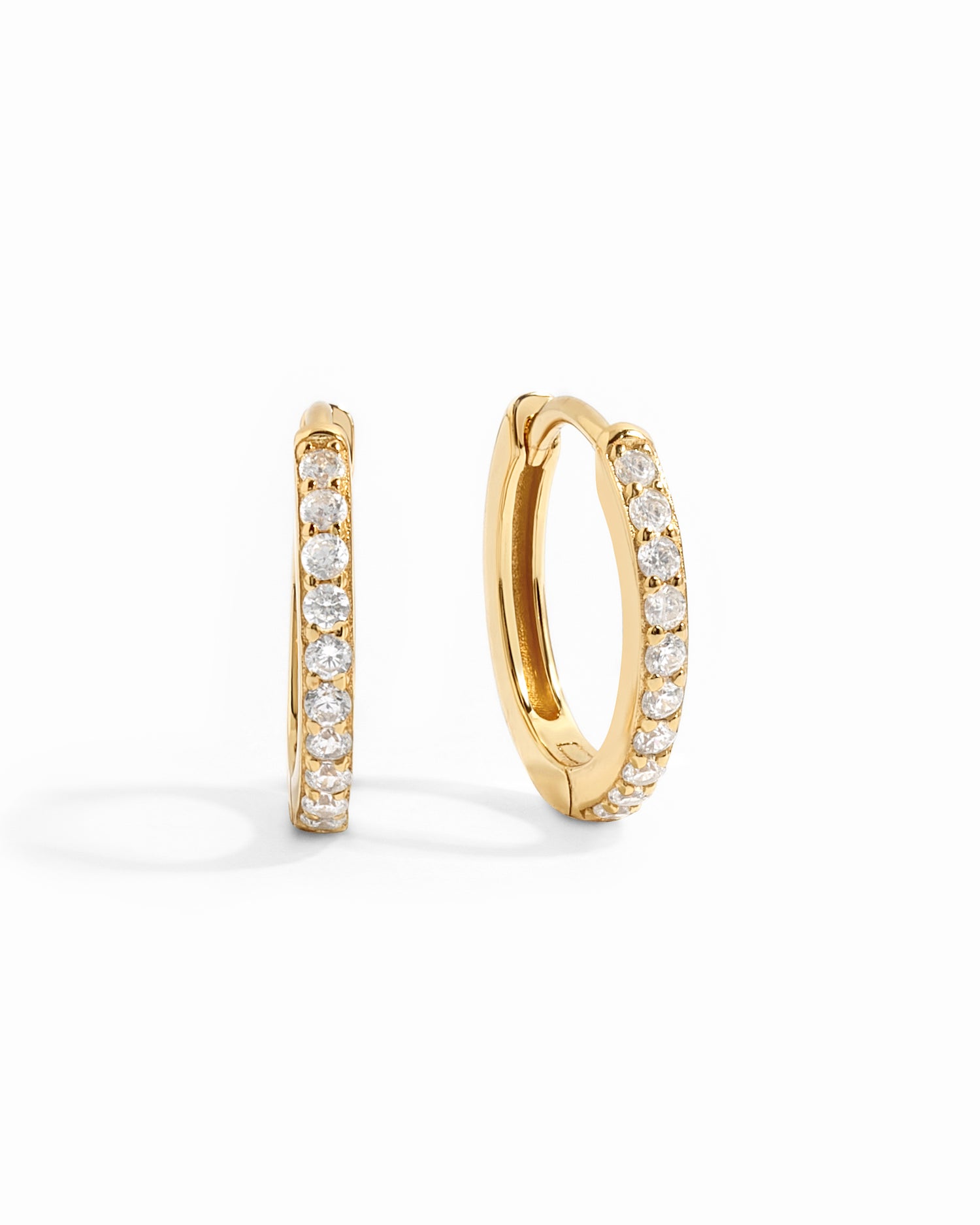gold 13mm studded huggie hoop earring white background