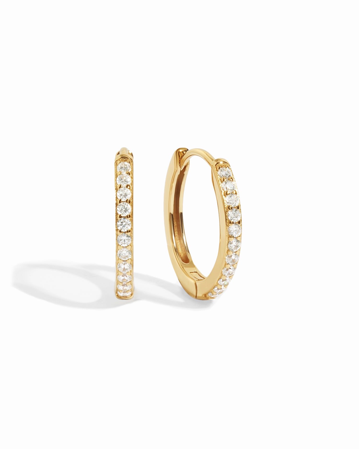 gold 16mm studded huggie hoop earring white background