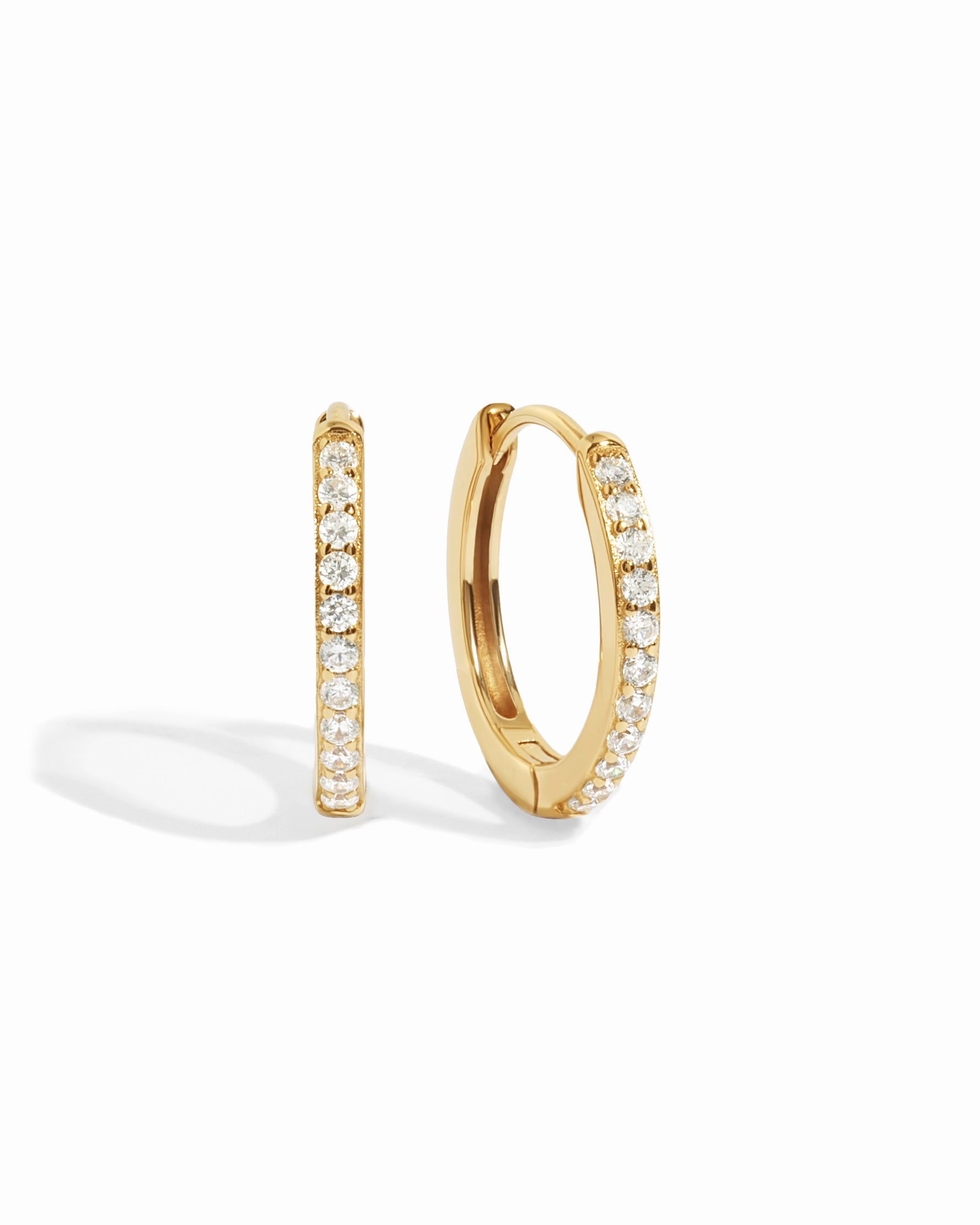 gold 16mm studded huggie hoop earring white background