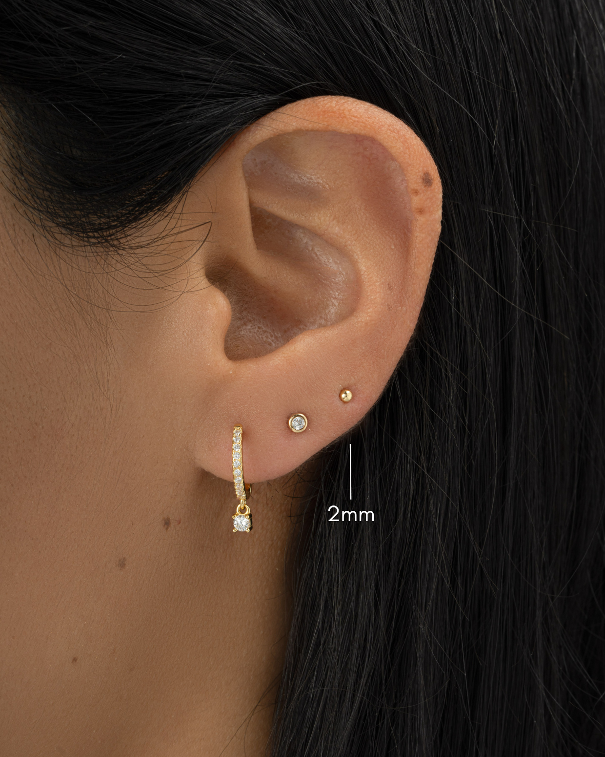 gold 2mm ball stud earring stack on womens ear