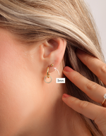 gold 3mm ball stud earring on womens ear 