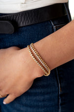 gold 3mm round tennis bracelet stack on womens arm 