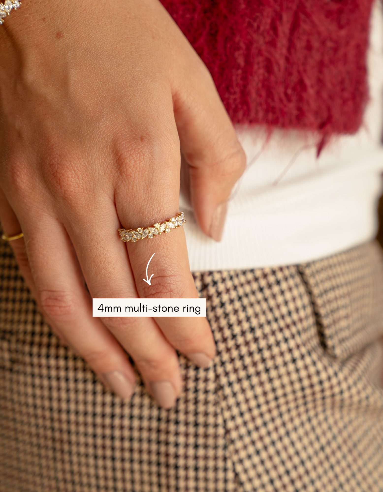 4mm gold multistone ring on womens hand