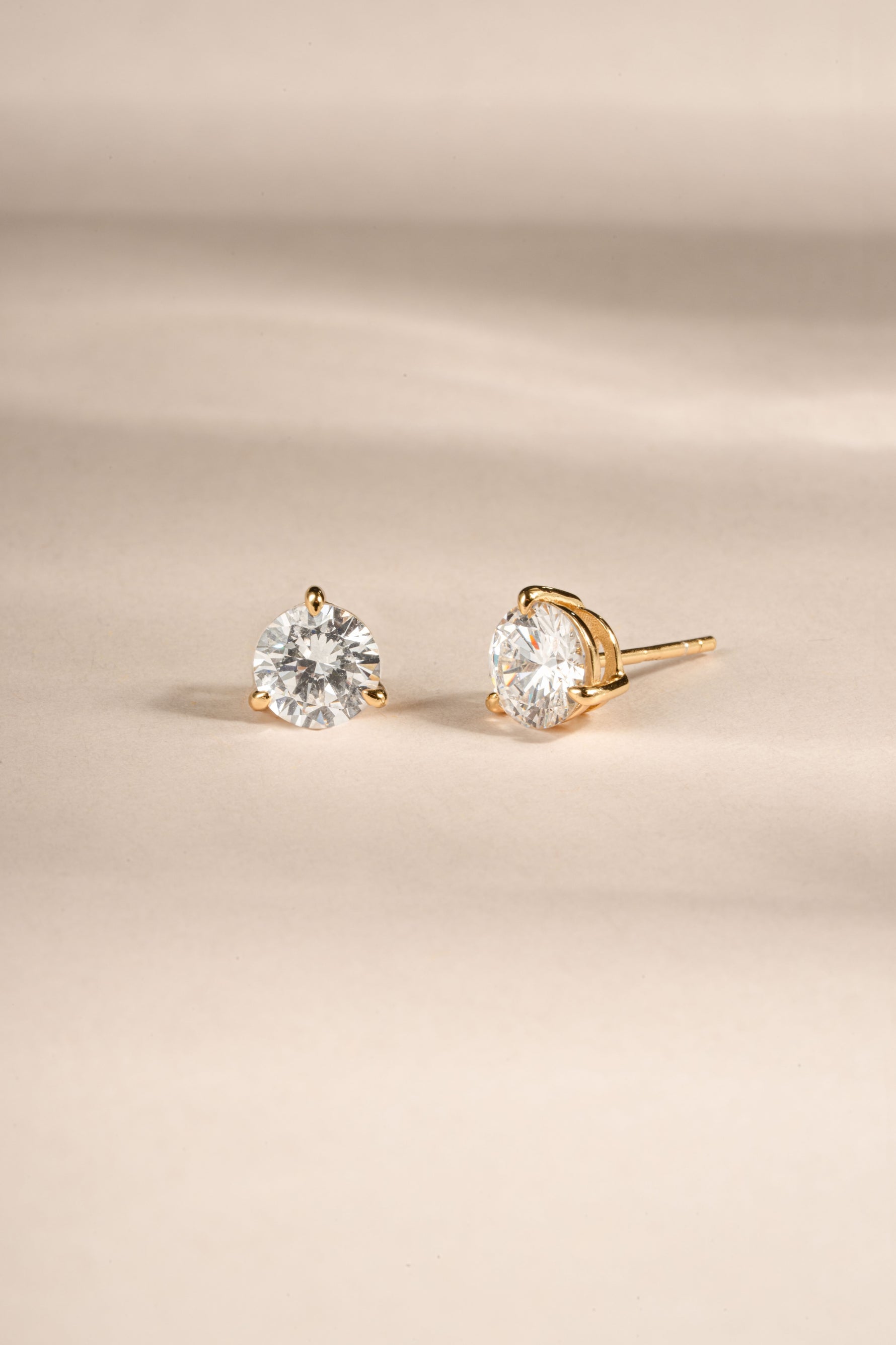 gold round solitaire diamond stud earrings close uo