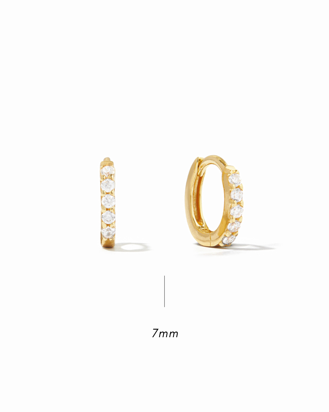 Gold 7mm hoop earrings with embedded stones with size white background