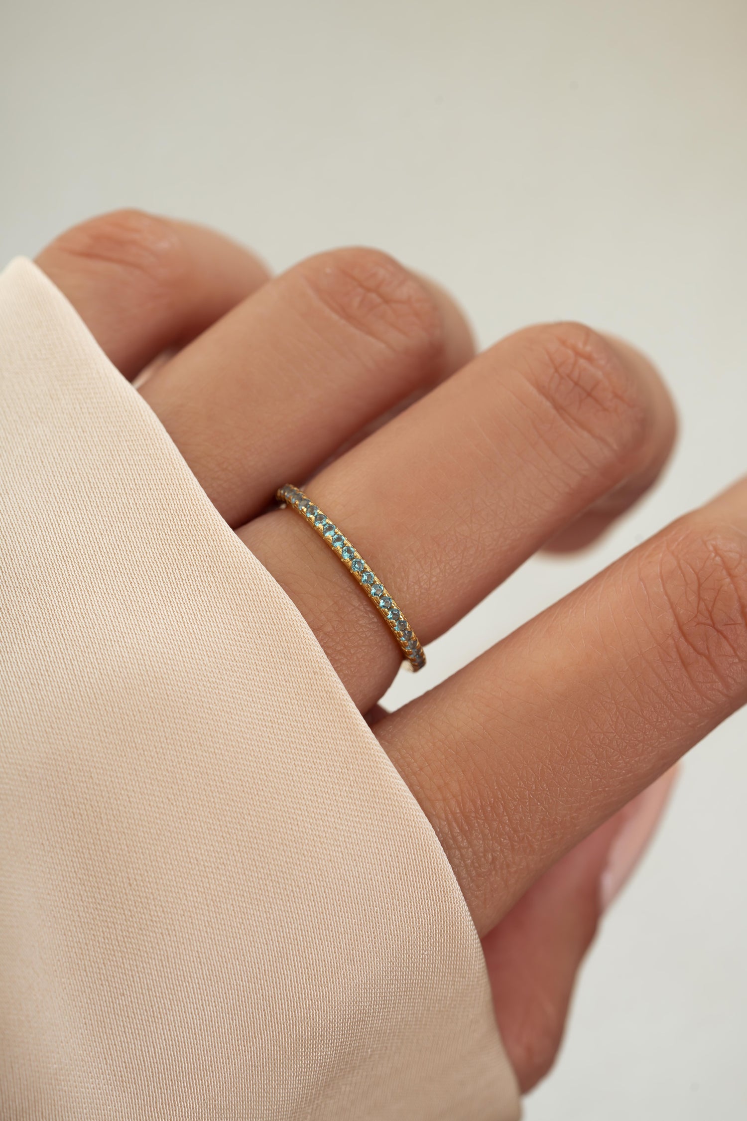 gold aquamarine birthstone eternity ring model