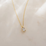 Gold Stacy Diamond Pendant Necklace featuring a baguette-cut diamond charm by Sami Jewels.
