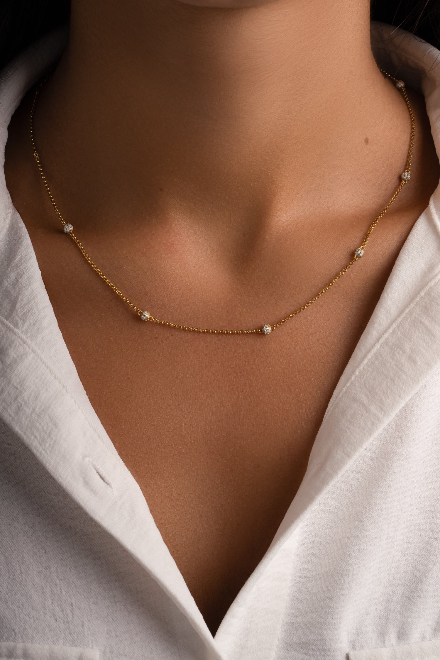 Close-up of Sami Jewels gold beaded pavé necklace with sparkling diamond beads and intricate detailing.