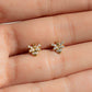 models hand showcasing dainty bee stud earring with dainty cubic zirconia stones