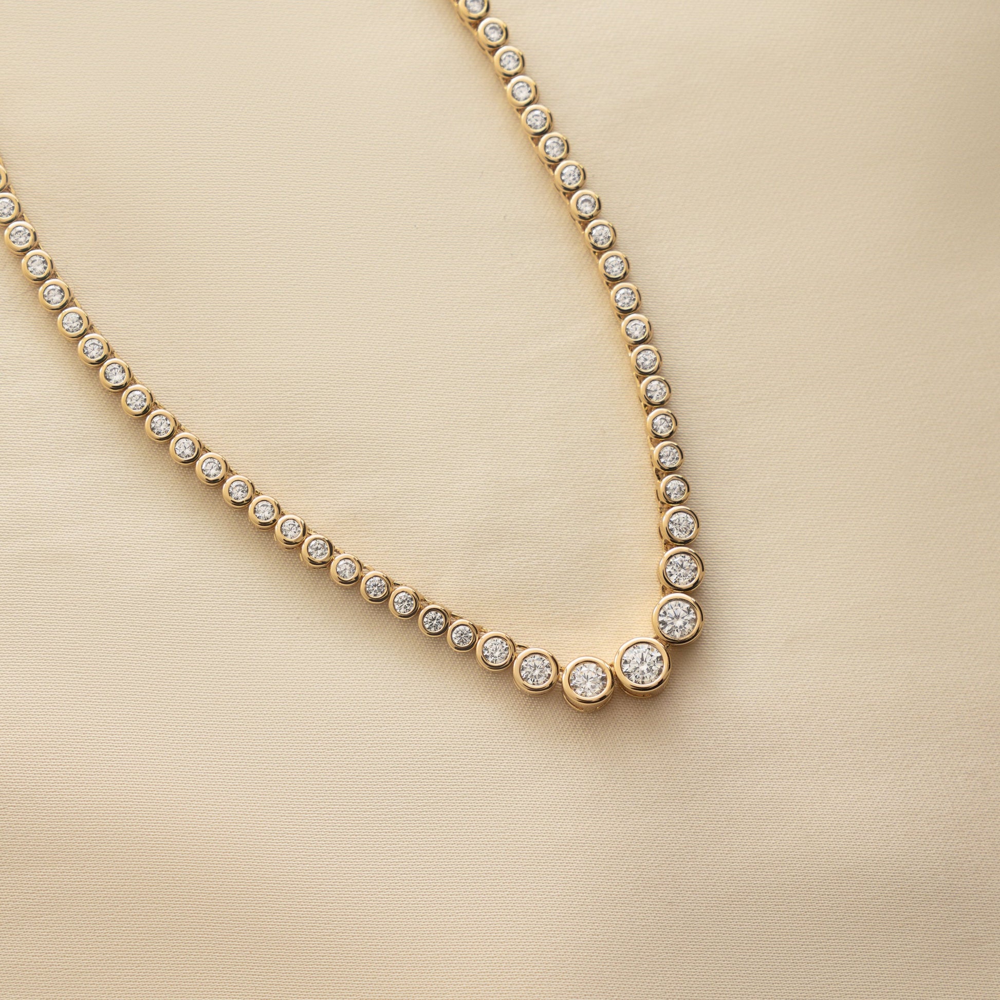 closer view of dainty necklace featuring the intricate details of the diamond bezel.