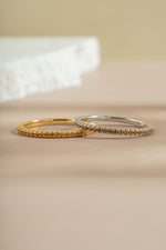 gold and sterling silver citrine birthstone eternity ring neutral background