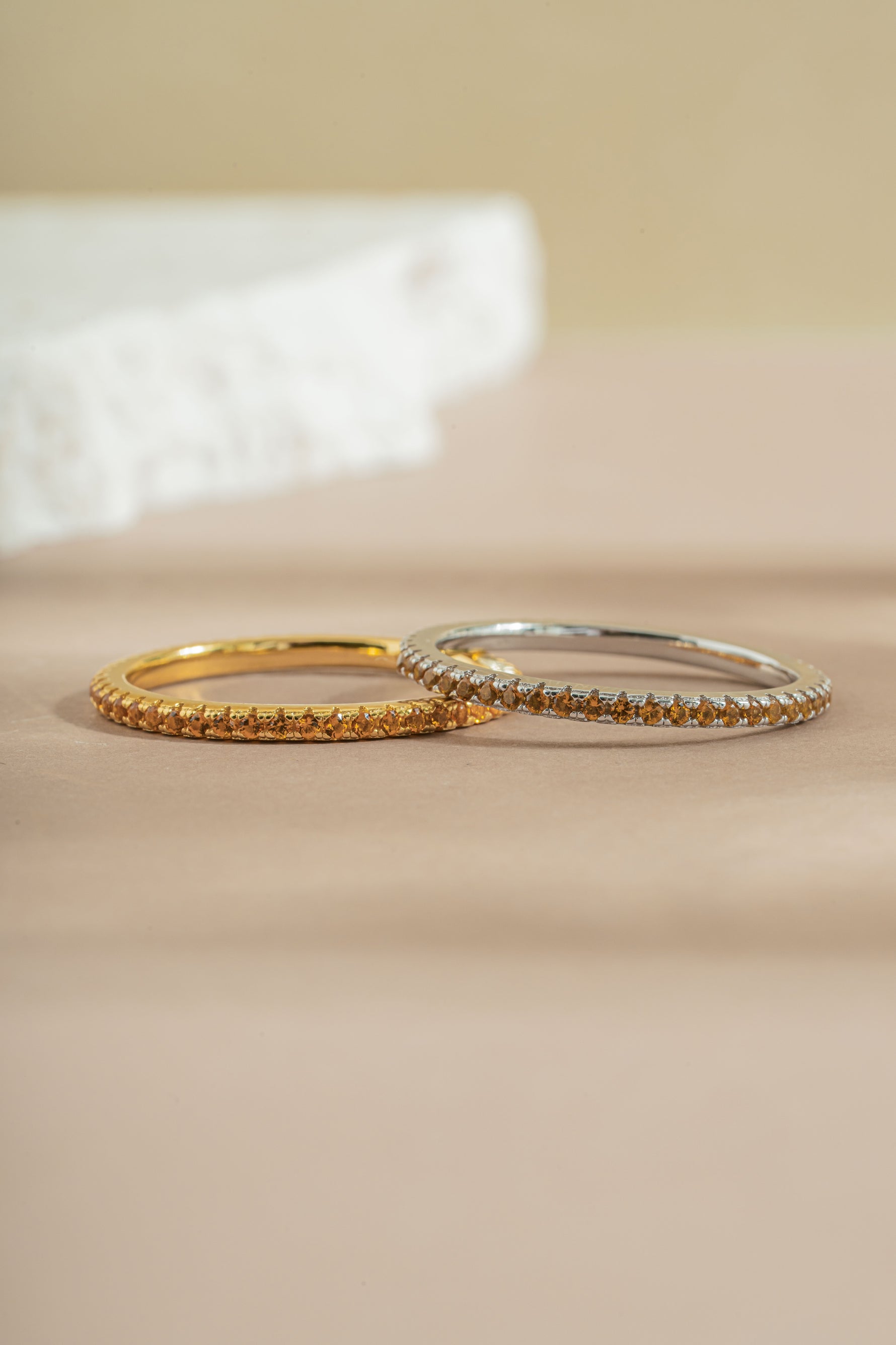 gold and sterling silver citrine birthstone eternity ring neutral background