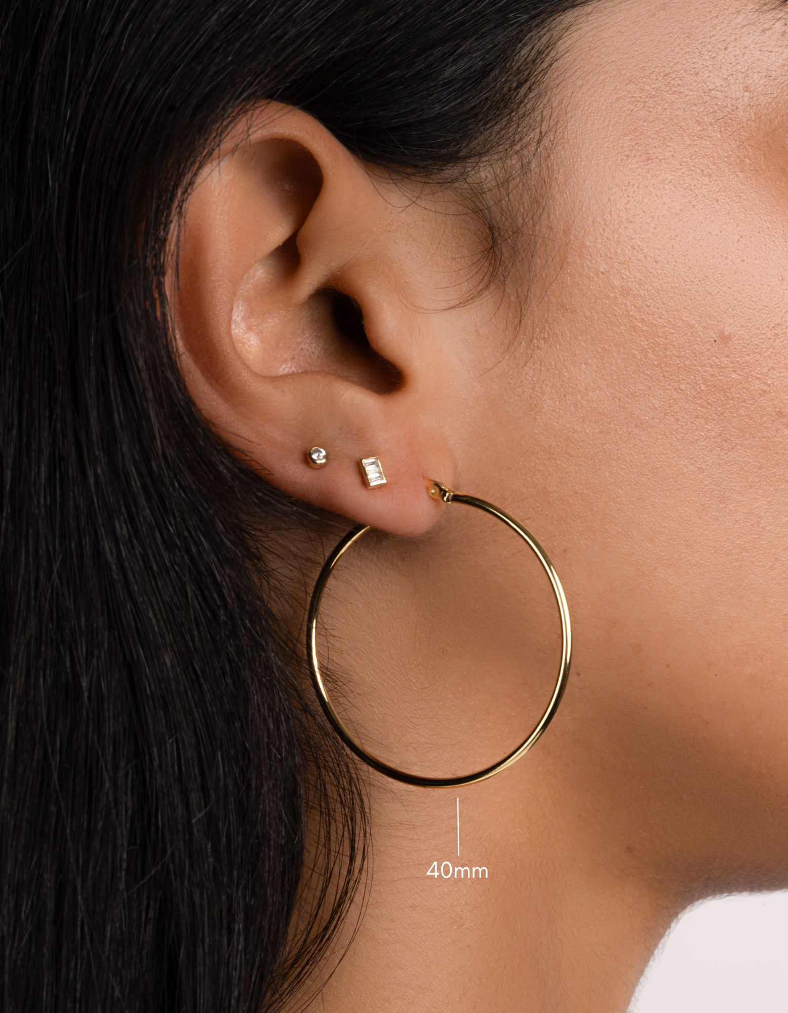 gold classic hoop earrings on model in 40mm size