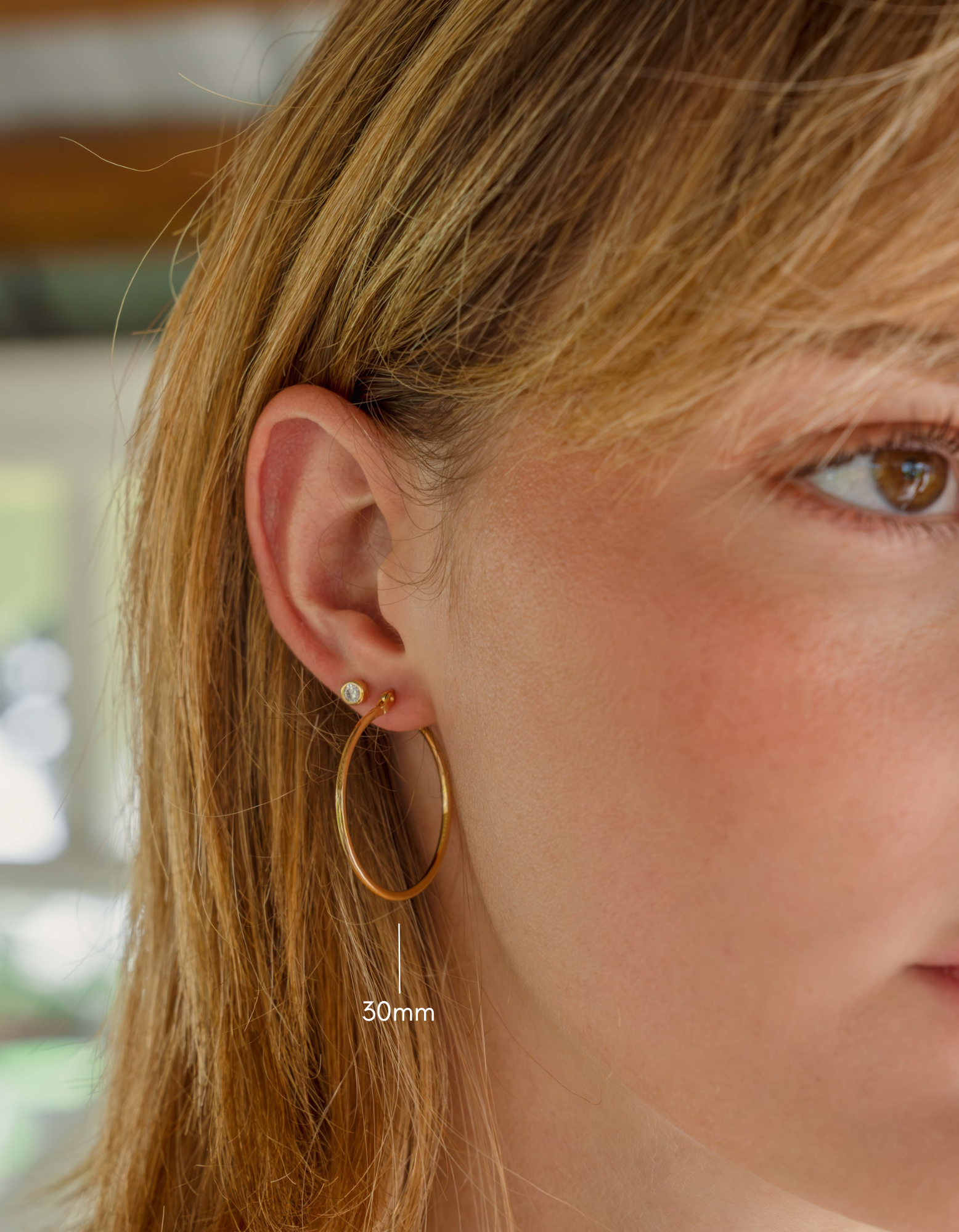 gold classic hoop earrings on model in 30mm size