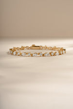Gold dainty bracelet with marquise and round diamond stones, elegant jewelry piece by Sami Jewels