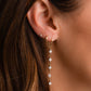 Model wearing CZ Diamond  Earrings stacked with other gold earrings and simple diamond studs