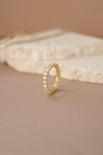 gold studded eternity ring side view