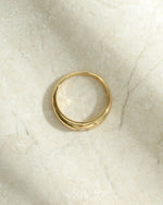 gold bezeled dome ring with cubic zirconia stone top view
