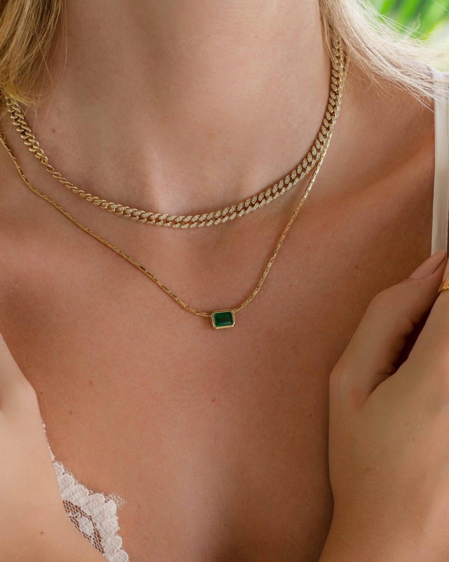 gold baguette necklace on model 