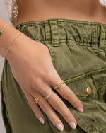 emerald diamond baguette ring stack on models hand