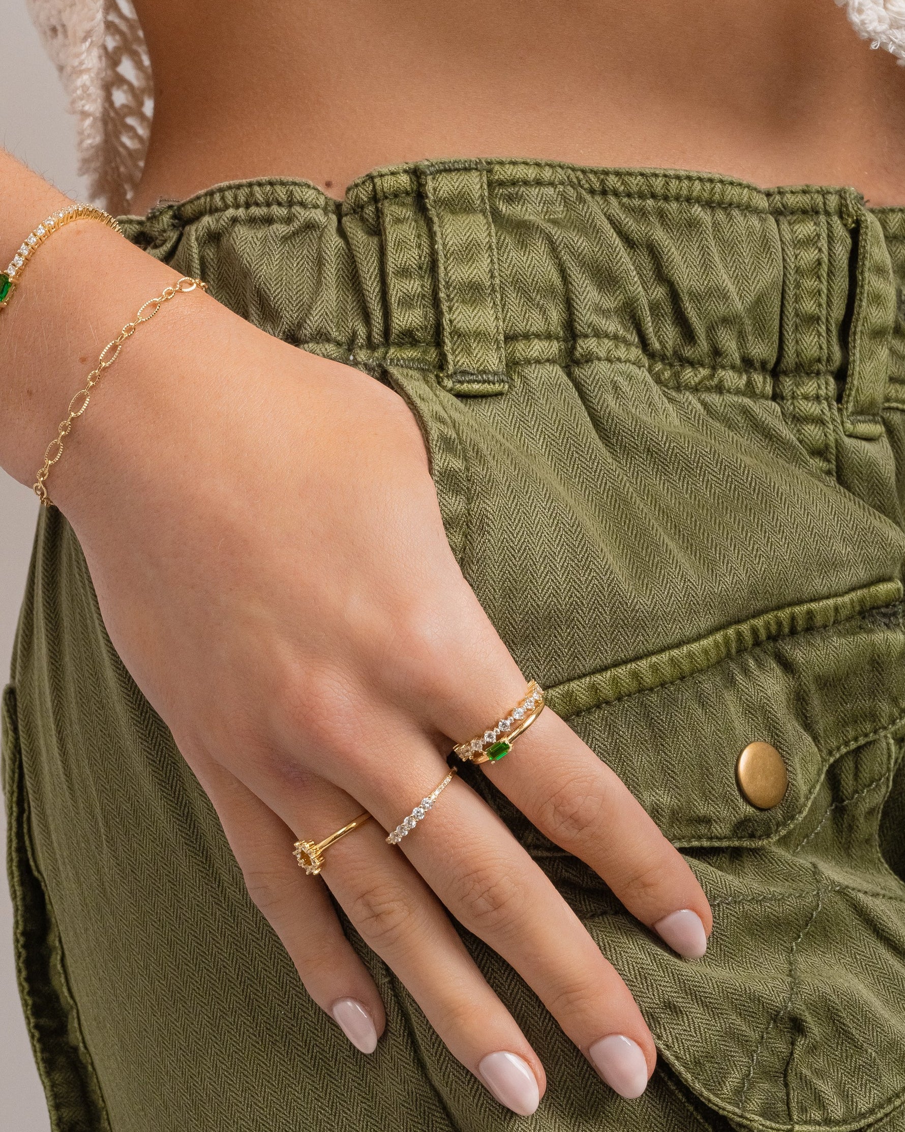 emerald diamond baguette ring stack on models hand