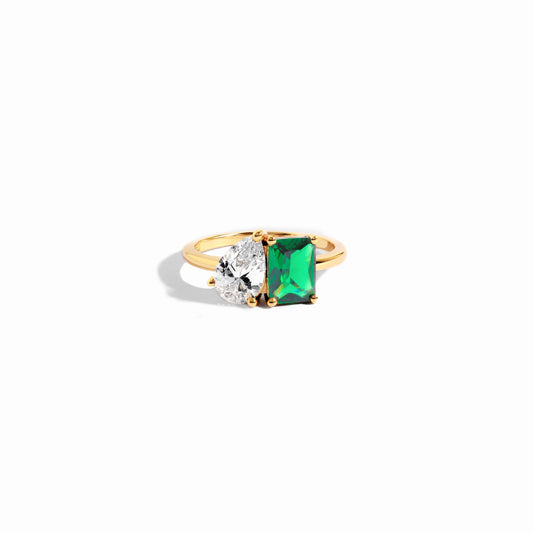 closeup image of emerald green toi et moi ring